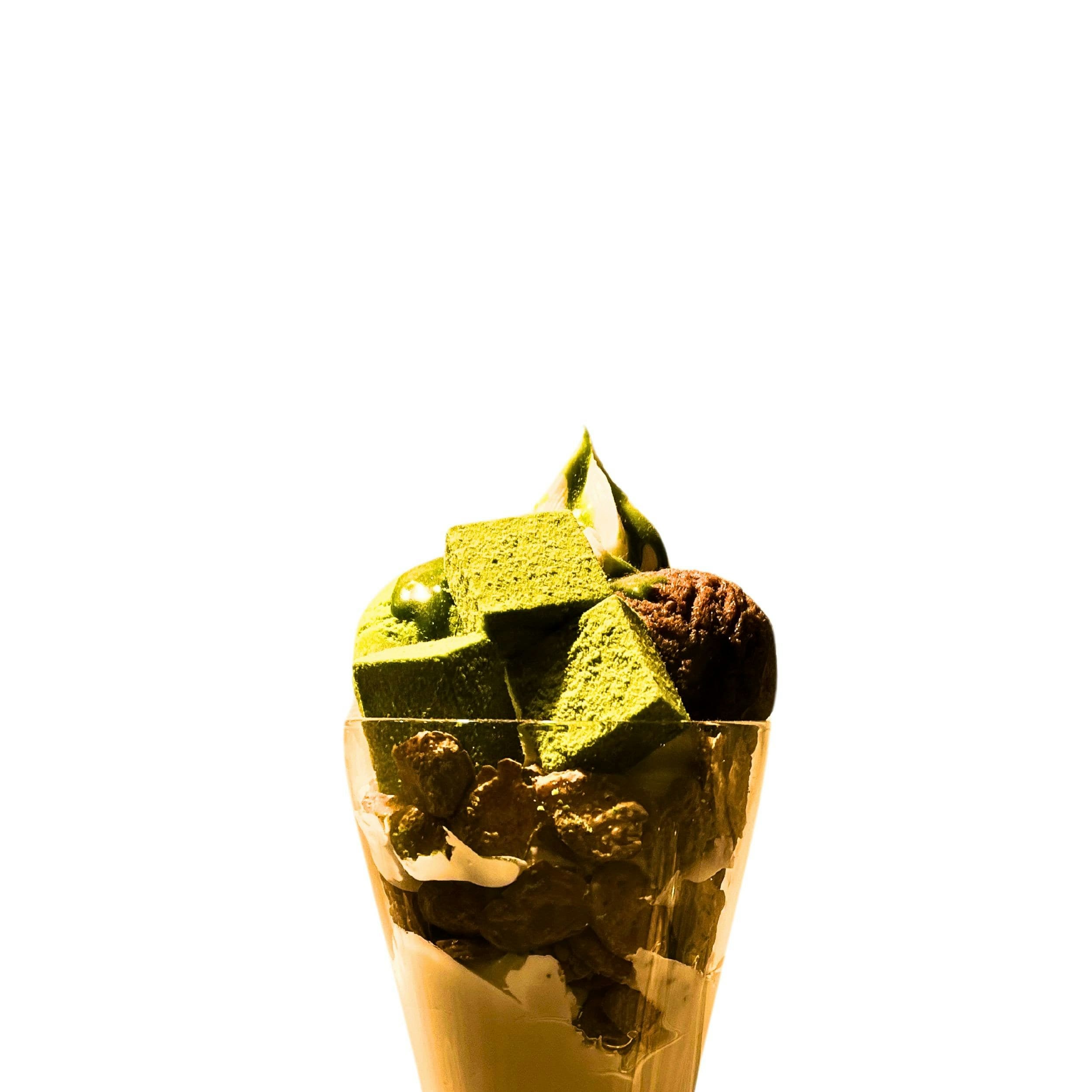 Dessert with various toppings in a glass cup (illustrative image)