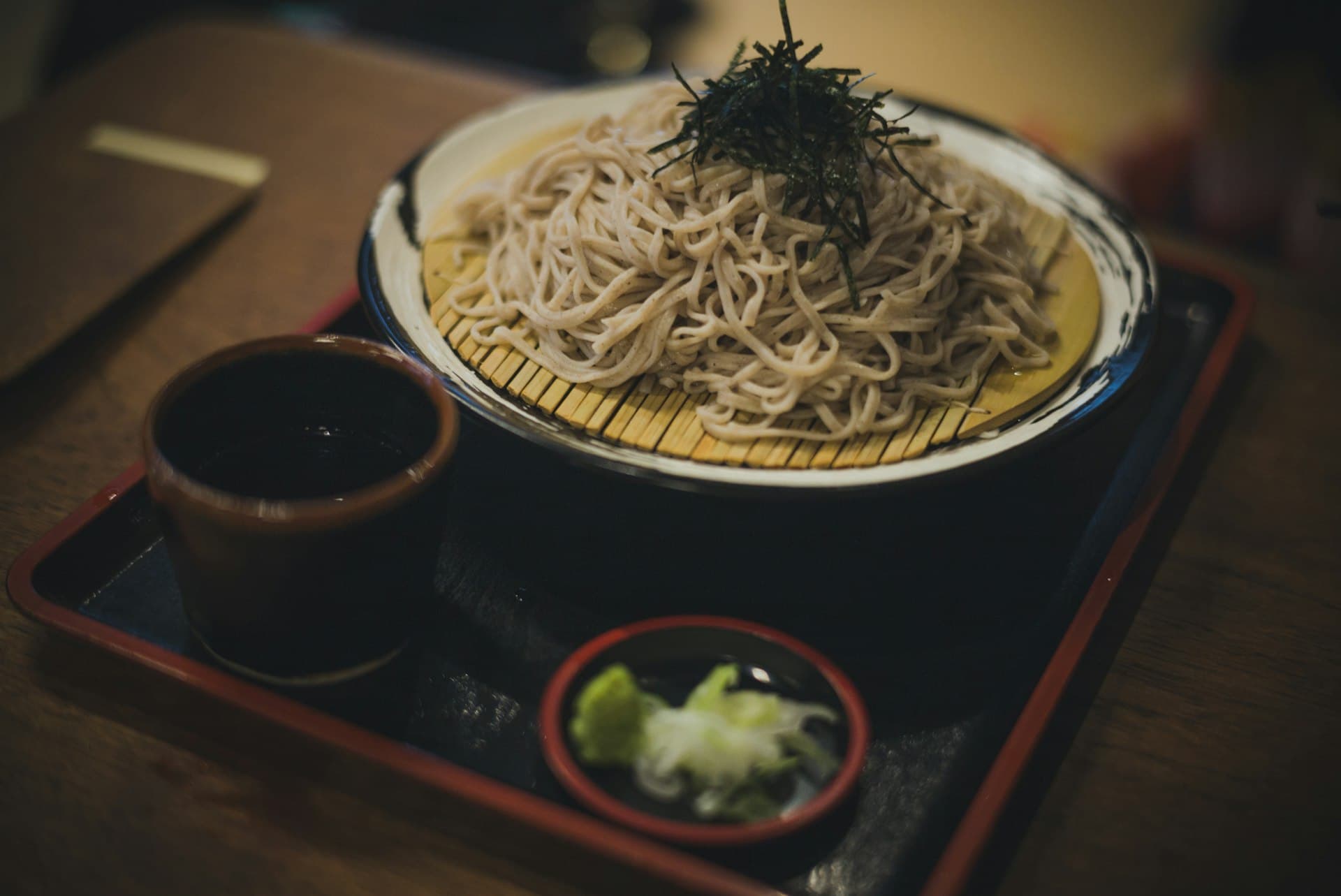 Zaru soba topped with nori, served with dipping sauce and condiments (illustrative image)