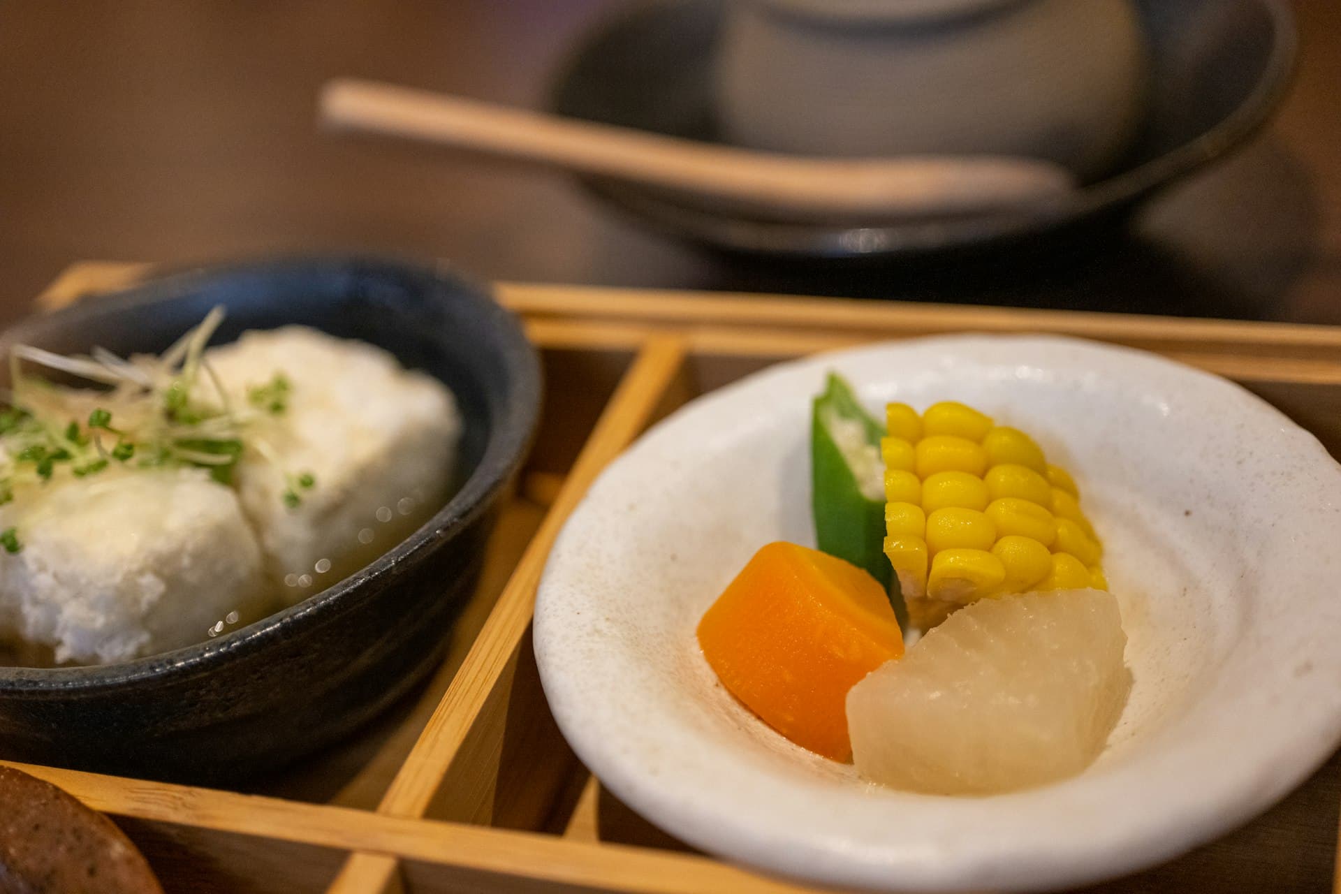 Homemade tofu and a small dish of simmered seasonal vegetables (illustrative image)